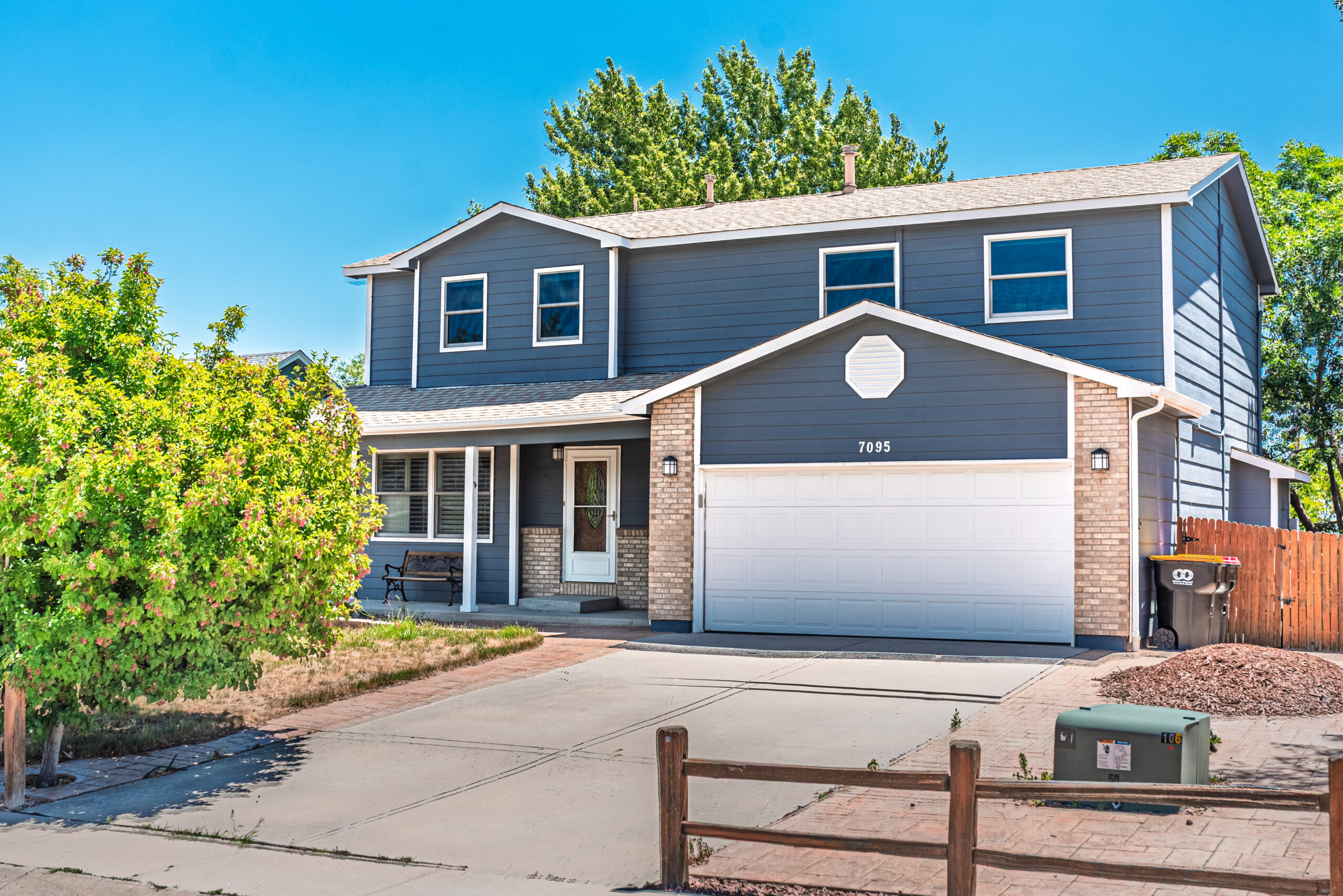 Front of the two-story Apollo House with a two-car garage in Cimarron Hills, Colorado Springs